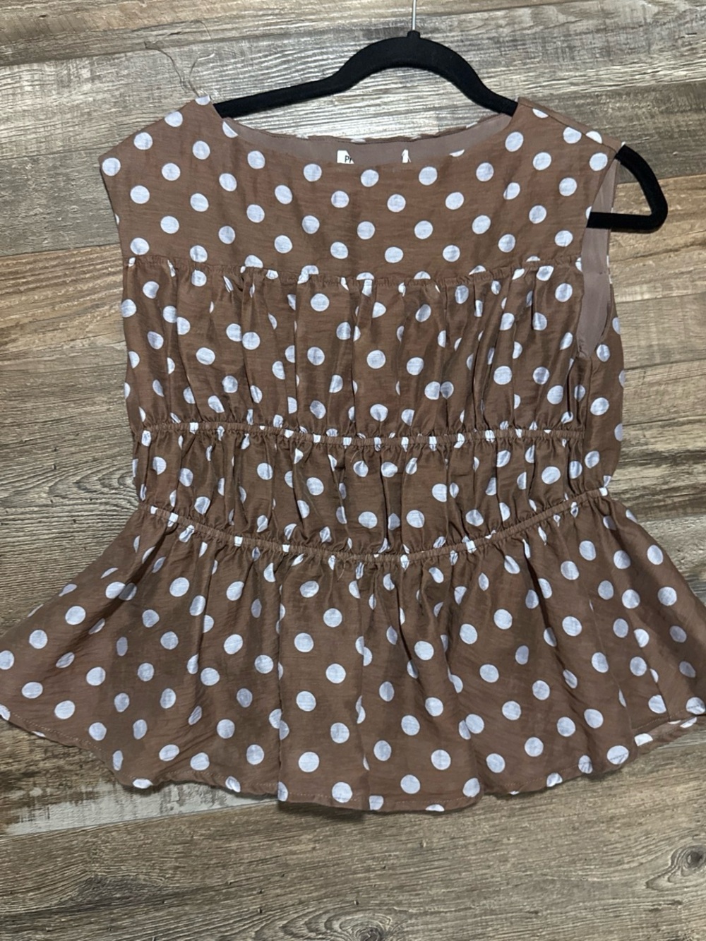 Brown & white polka dot blouse with ruffled hem